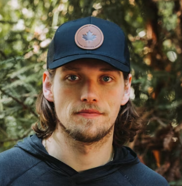Man Dark Cap Outdoor Portrait